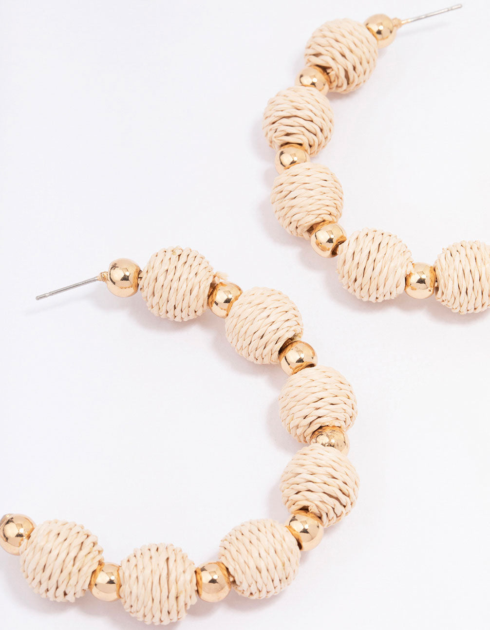 Large Gold-Toned Hoop Earrings Decorated with Raffia Balls